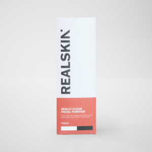Realskin Facial Purifier in a two-tone red rectangle box