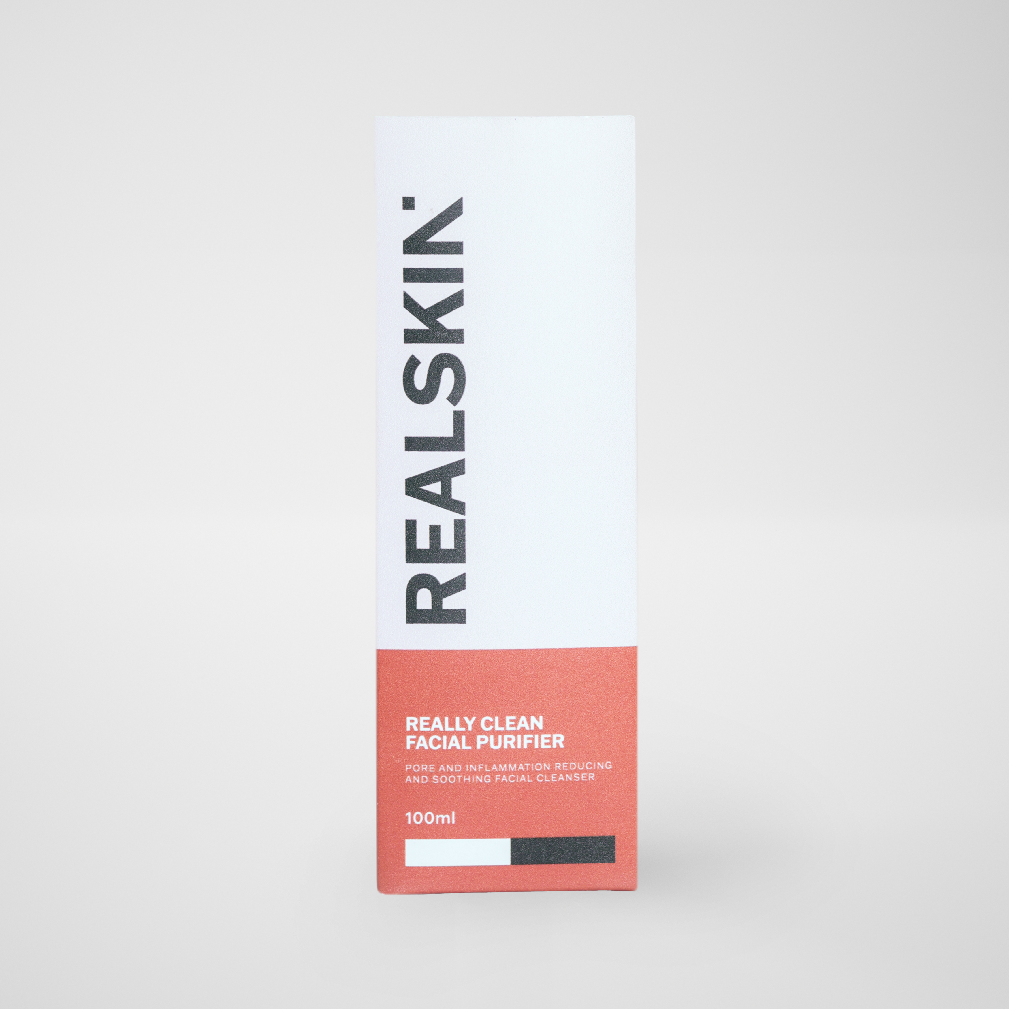Realskin Facial Purifier in a two-tone red rectangle box